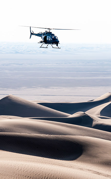 Bell 407 Light Assualt Modified Flying Over Desert